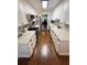 Bright kitchen featuring white cabinets, quartz countertops, farmhouse sink, and modern stainless appliances at 1606 Waterside Blvd, Moncks Corner, SC 29461