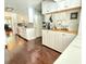 Bright eat-in kitchen features a coffee bar and stainless appliances and farmhouse sink at 1606 Waterside Blvd, Moncks Corner, SC 29461