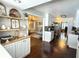 Bright eat-in kitchen features open shelving, stainless appliances, and breakfast bar at 1606 Waterside Blvd, Moncks Corner, SC 29461