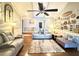 Spacious living room boasts wood floors, a ceiling fan, and decorative wall art at 1606 Waterside Blvd, Moncks Corner, SC 29461