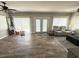 Spacious living room boasts wood floors, natural light, and a comfortable gray recliner at 1606 Waterside Blvd, Moncks Corner, SC 29461