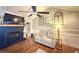 Living room view includes a fireplace, large TV and hardwood floors in a neutrally painted room at 1606 Waterside Blvd, Moncks Corner, SC 29461