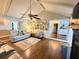 Open concept living room with vaulted ceilings, hardwood floors, modern furniture and a cozy seating area at 1606 Waterside Blvd, Moncks Corner, SC 29461