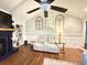 Bright living room with vaulted ceiling, fireplace, built-in shelving, and comfortable seating at 1606 Waterside Blvd, Moncks Corner, SC 29461