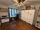 Functional home office boasts hardwood flooring, a built-in storage unit, and a comfortable workspace at 1606 Waterside Blvd, Moncks Corner, SC 29461