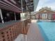 The outdoor bar features seating at the bar, hanging swings, and overlooks the pool and backyard at 1606 Waterside Blvd, Moncks Corner, SC 29461