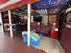 The outdoor bar features a dining area and quirky decorations, offering a unique entertaining space at 1606 Waterside Blvd, Moncks Corner, SC 29461