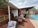 The outdoor kitchen and dining area are next to the pool for a seamless transition from cooking to relaxing at 1606 Waterside Blvd, Moncks Corner, SC 29461