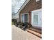 Charming patio area with brick accents, potted plants, and direct access to the beautiful outdoor pool at 1606 Waterside Blvd, Moncks Corner, SC 29461