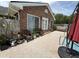 Outdoor patio area shows the exterior of the home, chairs, and in-ground swimming pool at 1606 Waterside Blvd, Moncks Corner, SC 29461