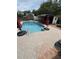 An outdoor pool features a custom designed patio and a bar for relaxing and entertaining guests at 1606 Waterside Blvd, Moncks Corner, SC 29461