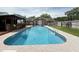 Spacious backyard featuring a sparkling pool, poolside bar, and beautifully landscaped garden for outdoor enjoyment at 1606 Waterside Blvd, Moncks Corner, SC 29461