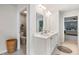 Stylish bathroom featuring double vanity sinks and a toilet room through an open doorway at 167 Cherry Grove Dr, Summerville, SC 29483