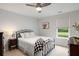 Bedroom with a black metal frame bed, a ceiling fan, and a window with a view of the backyard at 167 Cherry Grove Dr, Summerville, SC 29483