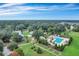 An aerial view showing a luxurious community pool surrounded by lush landscaping and green trees at 167 Cherry Grove Dr, Summerville, SC 29483