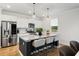 Modern kitchen with white cabinets, granite countertops, stainless steel appliances, and a center island with seating at 167 Cherry Grove Dr, Summerville, SC 29483
