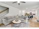 Open-concept living room with dining area and kitchen view, featuring a comfortable gray sectional sofa at 167 Cherry Grove Dr, Summerville, SC 29483