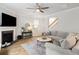 Cozy living room with fireplace, mantel, and a comfortable seating area near a large window at 167 Cherry Grove Dr, Summerville, SC 29483