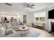 Spacious living room with a comfortable gray sofa, a decorative rug, and plenty of natural light at 167 Cherry Grove Dr, Summerville, SC 29483