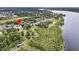 Beautiful aerial view of a home nestled amidst green trees and waterways, offering a scenic waterfront perspective at 1711 Indigo Island Dr, Hanahan, SC 29410