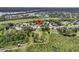 Expansive aerial shot of the property showcasing a home with lush surroundings and access to a waterway at 1711 Indigo Island Dr, Hanahan, SC 29410