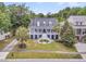 Beautifully landscaped home with palm trees and an expansive lawn at 1711 Indigo Island Dr, Hanahan, SC 29410