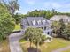 Aerial view of a gorgeous home surrounded by lush greenery, mature trees, and impeccable landscaping at 1711 Indigo Island Dr, Hanahan, SC 29410
