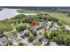 Scenic aerial of the property, highlighting its neighborhood, landscaping, and proximity to a waterway at 1711 Indigo Island Dr, Hanahan, SC 29410