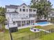 Aerial view showcasing the backyard with a pool, patio, fire pit and multiple decks on the home at 1711 Indigo Island Dr, Hanahan, SC 29410