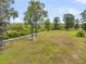 Aerial view of the backyard featuring a wooden walkway and mature trees, ideal for outdoor living at 1711 Indigo Island Dr, Hanahan, SC 29410