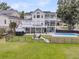 Aerial view of the home showcasing the fenced backyard with a fire pit, pool and multiple decks at 1711 Indigo Island Dr, Hanahan, SC 29410