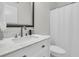 Bright bathroom with white vanity, marble countertop, and modern fixtures at 1711 Indigo Island Dr, Hanahan, SC 29410