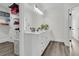 Well-lit bathroom with a large vanity, walk-in closet, and modern fixtures at 1711 Indigo Island Dr, Hanahan, SC 29410