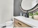 Modern powder room with stylish vanity, round mirror, and elegant decor at 1711 Indigo Island Dr, Hanahan, SC 29410