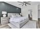 Spacious bedroom features a stylish accent wall, a plush bed, and modern nightstands at 1711 Indigo Island Dr, Hanahan, SC 29410