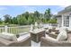 Beautiful outdoor space featuring wicker seating around a table with an incredible view at 1711 Indigo Island Dr, Hanahan, SC 29410