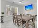 Dining area featuring a table, seating for eight, and a view of the outside patio at 1711 Indigo Island Dr, Hanahan, SC 29410