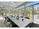 Bright sunroom featuring expansive views and a large dining table and chairs at 1711 Indigo Island Dr, Hanahan, SC 29410