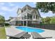 Expansive view of the home's exterior with a beautiful blue pool and spacious patio area at 1711 Indigo Island Dr, Hanahan, SC 29410