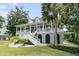 Charming two-story home with a grand front porch and beautiful landscaping at 1711 Indigo Island Dr, Hanahan, SC 29410