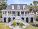 Stunning two-story home featuring a grand entrance, double staircases, and a charming front porch at 1711 Indigo Island Dr, Hanahan, SC 29410