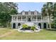 Beautiful two-story home with a large porch, manicured landscaping, and a welcoming front entrance at 1711 Indigo Island Dr, Hanahan, SC 29410