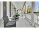 A spacious front porch with elegant columns, comfortable seating, and stylish decor at 1711 Indigo Island Dr, Hanahan, SC 29410