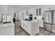 Modern kitchen with stainless steel appliances, a large island, and plenty of storage space at 1711 Indigo Island Dr, Hanahan, SC 29410