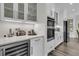 Modern kitchen with white cabinets, stainless steel appliances, and a built-in wine refrigerator at 1711 Indigo Island Dr, Hanahan, SC 29410