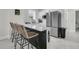 Bright kitchen boasts stainless steel appliances, breakfast bar with seating, and white cabinets at 1711 Indigo Island Dr, Hanahan, SC 29410