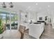 Open kitchen featuring white cabinets, stainless steel appliances, and dining area access at 1711 Indigo Island Dr, Hanahan, SC 29410
