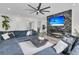 Modern living room with a marble fireplace, large TV, and a comfortable sectional sofa at 1711 Indigo Island Dr, Hanahan, SC 29410