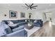 Bright living room featuring wood floors, a sectional sofa, and contemporary decor at 1711 Indigo Island Dr, Hanahan, SC 29410