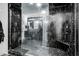 Modern shower with black marble tile, glass enclosure, and dual shower heads at 1711 Indigo Island Dr, Hanahan, SC 29410